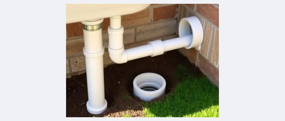 Connecting outdoor sink drain to catch basin dry well