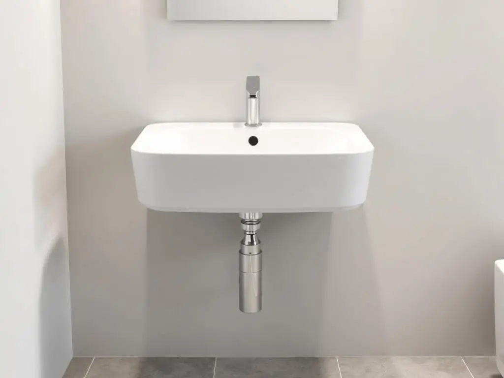 Wall-mounted sink showing the floating design with exposed plumbing underneath Wall-mounted sink showing the floating design with exposed plumbing underneath